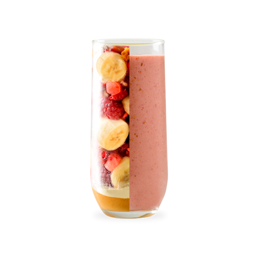 PACK'D Peanut butter jelly protein smoothie kit, glass with half fruit, half smoothie